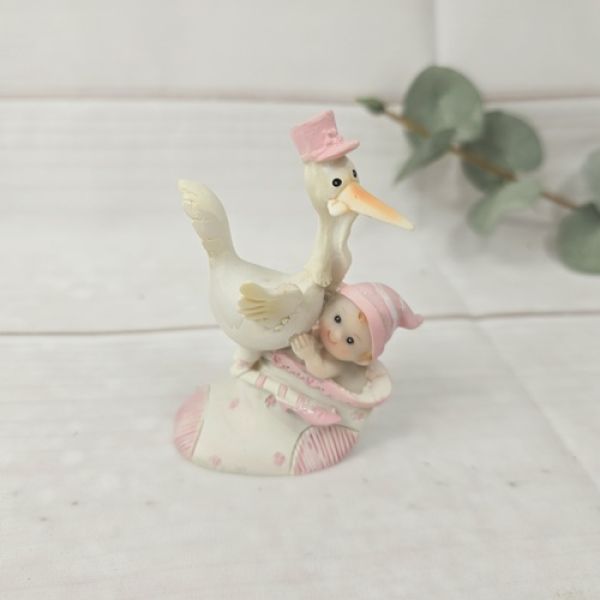 Figur Storch mit Baby Mädchen